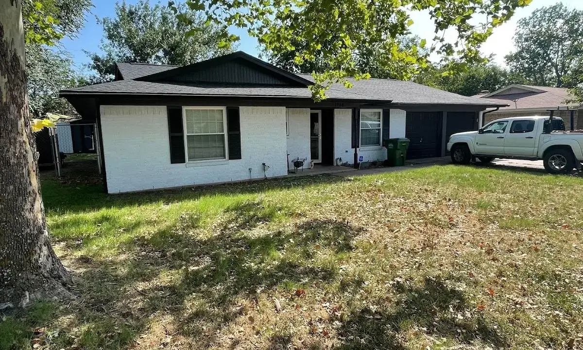 Professional roofing crew working on a residential roof in Tysons